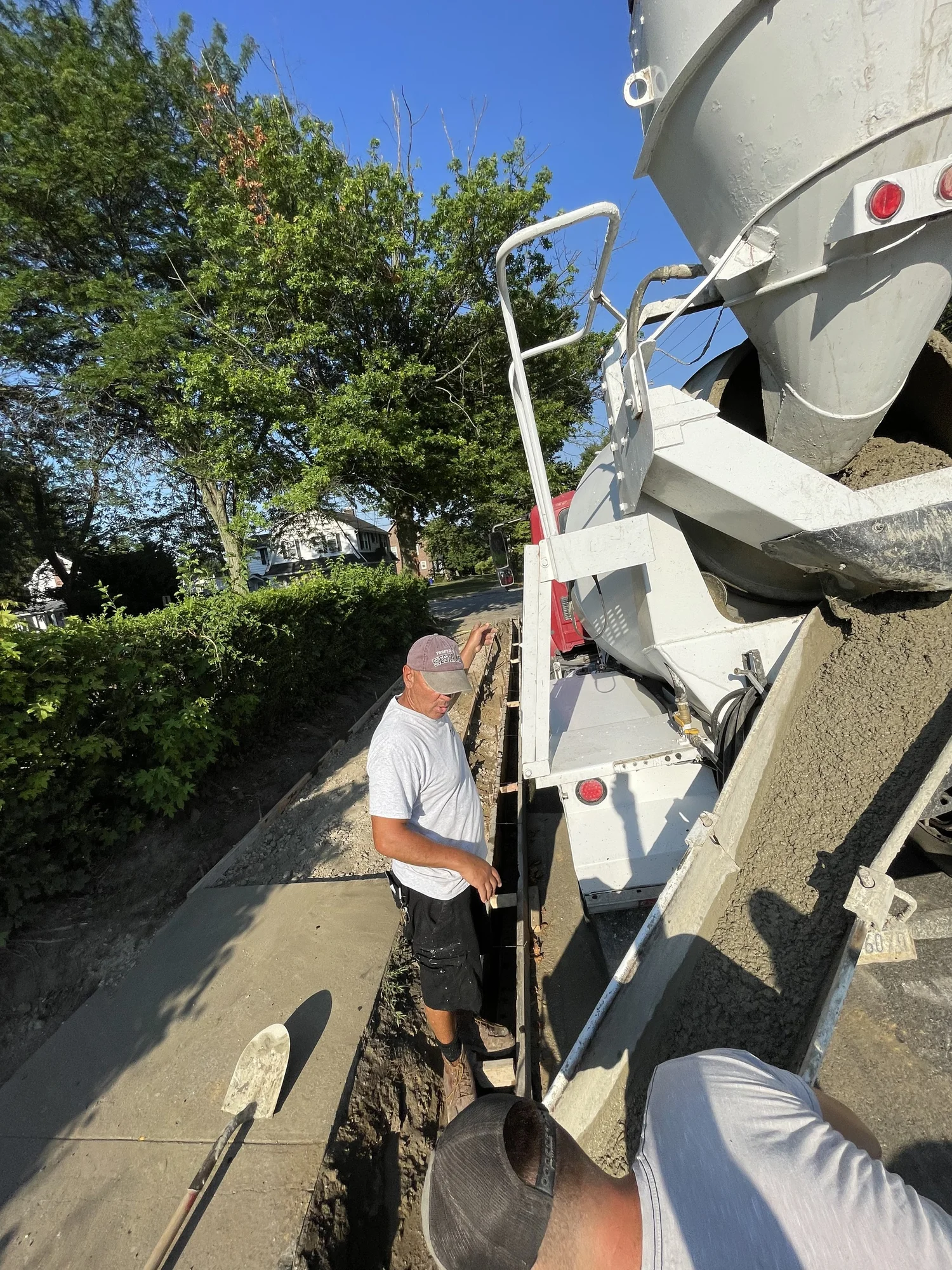 DiGiacomo Construction crew pouring concrete from the mixer